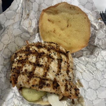 Conviction Chicken - a piece of bread and a sandwich - Chicken Wings Near Me - Arlington, Texas