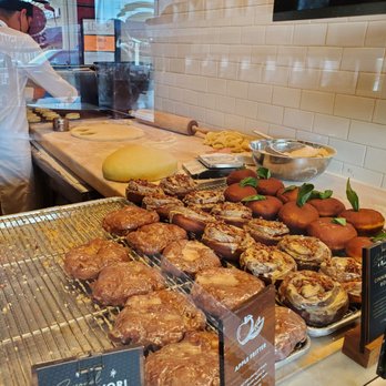 Sidecar Doughnuts & Coffee - Apple fritters, cinnamon rolls, basil eggs benedicts on display - Donuts Near Me - Costa Mesa, California