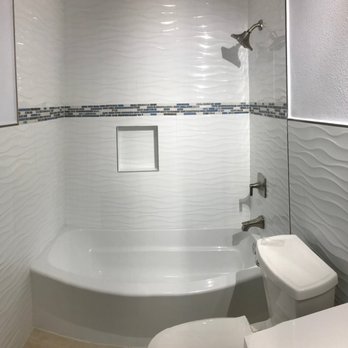 Tile Depot - bathroom to convey ocean theme - wavy tiles with seashell accent trim. - Flooring Near Me - South El Monte, California Tile Depot - bathroom to convey ocean theme - wavy tiles with seashell accent trim. - Flooring Near Me - South El Monte, California