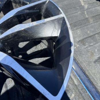 Us Tire Center - Right after the repair at the tire shop, just a slight miss match on the black paint. The black paint they used wasn't as glossy. - Tires Near Me - Las Vegas, Nevada