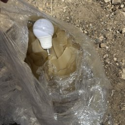 Glass lamp shade left broken in front of our new house