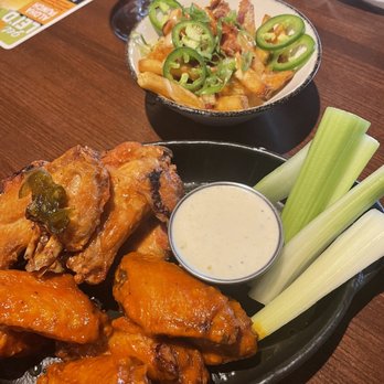 Bar Louie - Katy - Wings (buffalo and honey jalapeño) loaded fries - Bars Near Me - Katy, Texas Bar Louie - Katy - Wings (buffalo and honey jalapeño) loaded fries - Bars Near Me - Katy, Texas