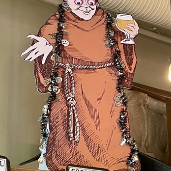 Thirsty Monk - a man holding a glass of beer - Breweries Near Me - Asheville, North Carolina