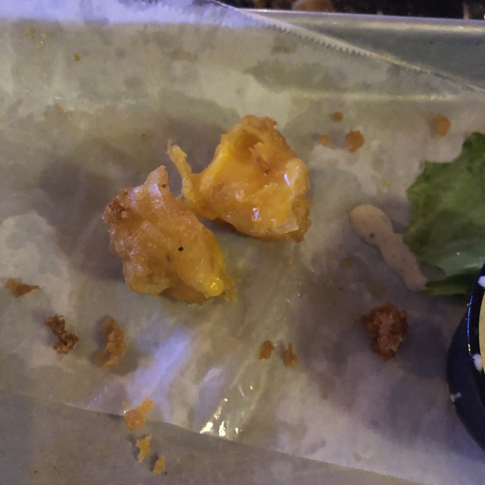 Cheese curd cut in half Cheese curd cut in half