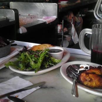 Cha Cha Cha - Chicken wings, Chicken Curry Empanada, and Platano Maduro w/a half pitcher of sangria - Caribbean Near Me - San Francisco, California Cha Cha Cha - Chicken wings, Chicken Curry Empanada, and Platano Maduro w/a half pitcher of sangria - Caribbean Near Me - San Francisco, California