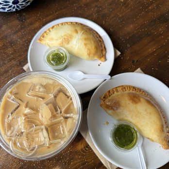 Cafe Guarani - Dulce de leche latte, breakfast empanada, and bacon empanada on a sparkly table! - Cafes Near Me - Pacific Grove, California