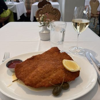 Goldener Hirsch Restaurant - Veiner schnitzel underneath was a delicious spinach and mustard seed potatoes - New American Near Me - Park City, Utah