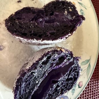 Yo Mochi Cafe - At home, the cut malasada with dark purple ube inside. - Donuts Near Me - Las Vegas, Nevada Yo Mochi Cafe - At home, the cut malasada with dark purple ube inside. - Donuts Near Me - Las Vegas, Nevada