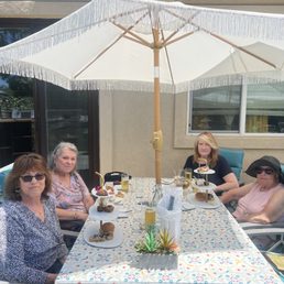 Two birthday girls, Karen Wells and Linda Kelly on left, and Back to front on the right is Susan Hallahan and Jeanne Sinclair (in the hat).