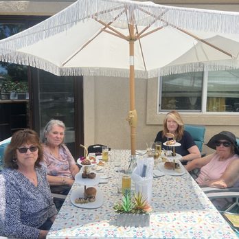 Bliss Tea & Treats - Two birthday girls, Karen Wells and Linda Kelly on left, and Back to front on the right is Susan Hallahan and Jeanne Sinclair (in the hat). - Tea Rooms Near Me - Oceanside, California