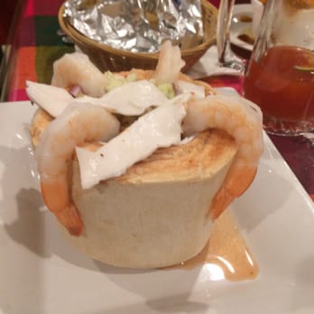 The Patroons Mexican Restaurant - Coconut filled with seafood!!  Was amazing. Broth like sauce but has a great flavor and tons of giant shrimp! - Mexican Near Me - McHenry, Illinois