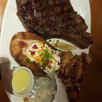 Outback Steakhouse - Bone-in Rib Eye with lobster tail, crab cake, & loaded baked potato - Steakhouses Near Me - Melbourne, Florida Outback Steakhouse - Bone-in Rib Eye with lobster tail, crab cake, & loaded baked potato - Steakhouses Near Me - Melbourne, Florida
