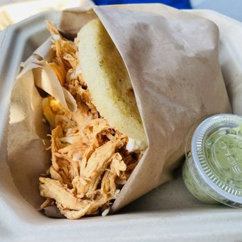 Papelon Arepa Bar - Arepa with green sauce - Venezuelan Near Me Papelon Arepa Bar - Arepa with green sauce - Venezuelan Near Me