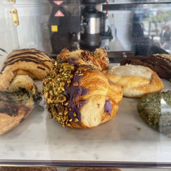 Pump Coffee - Vegan pastries from SPLIT Bakehouse. That middle one is has Ube purple yam and pistachios, and tastes like a cream puff. - Coffee & Tea Near Me - San Diego, California