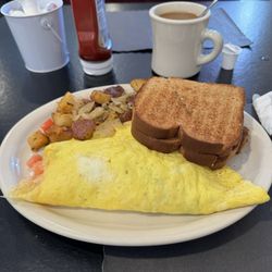 Greek omelette with wheat toast, pan fries with onions.