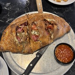 Nina’s Pizza Kitchen - Lotsa Meat- calzone Med