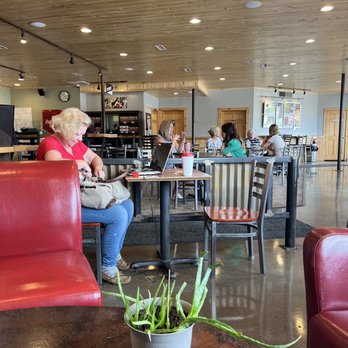 Durango Joes Coffee - a woman sitting at a table - Coffee & Tea Near Me - Durango, Colorado Durango Joes Coffee - a woman sitting at a table - Coffee & Tea Near Me - Durango, Colorado