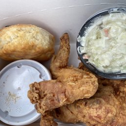 a box of fried chicken with a side of coleslaw