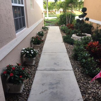 AMKO Lawn & Landscaping - walkway between two houses - Lawn Services Near Me - Coconut Creek, Florida AMKO Lawn & Landscaping - walkway between two houses - Lawn Services Near Me - Coconut Creek, Florida