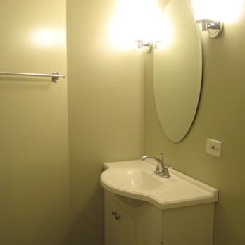 North Side Renovations - Installed new sconces, compact sink to make room in small bathroom, mirror. New paint. - General Contractors Near Me - Chicago, Illinois