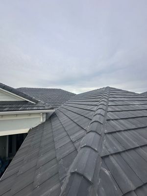 Westlake Saxony 900 Slate Concrete Tile Roof Replacement | Ponte Vedra Beach, FL - Our team completed a full roof replacement on this beautiful home in Ponte Vedra Beach, installing Westlake Royal Saxony 900 Slate concrete flat tile in the Dark Charcoal Blend color. This premium tile provides a sleek, modern slate look while delivering the durability and weather resistance needed for Florida’s climate.
For long-term protection, we installed a premium high-temperature peel-and-stick underlayment, creating a fully adhered waterproof barrier beneath the tile system. This helps protect the home from wind-driven rain and extreme heat while extending the service life of the roof.
From precise layout and flashing details to proper fastening and ventilation, every step was completed to meet or exceed Florida Building Code standards. The finished product delivers a stunning architectural upgrade with exceptional performance and peace of mind for the homeowner. Westlake Saxony 900 Slate Concrete Tile Roof Replacement | Ponte Vedra Beach, FL - Our team completed a full roof replacement on this beautiful home in Ponte Vedra Beach, installing Westlake Royal Saxony 900 Slate concrete flat tile in the Dark Charcoal Blend color. This premium tile provides a sleek, modern slate look while delivering the durability and weather resistance needed for Florida’s climate.
For long-term protection, we installed a premium high-temperature peel-and-stick underlayment, creating a fully adhered waterproof barrier beneath the tile system. This helps protect the home from wind-driven rain and extreme heat while extending the service life of the roof.
From precise layout and flashing details to proper fastening and ventilation, every step was completed to meet or exceed Florida Building Code standards. The finished product delivers a stunning architectural upgrade with exceptional performance and peace of mind for the homeowner.