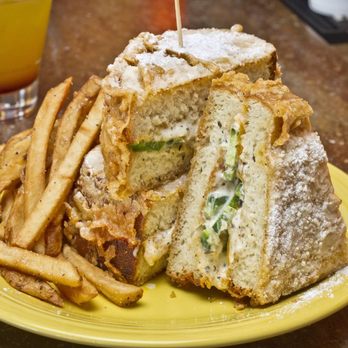 Melt University - a sandwich and french fries on a yellow plate - New American Near Me - Cleveland, Ohio Melt University - a sandwich and french fries on a yellow plate - New American Near Me - Cleveland, Ohio