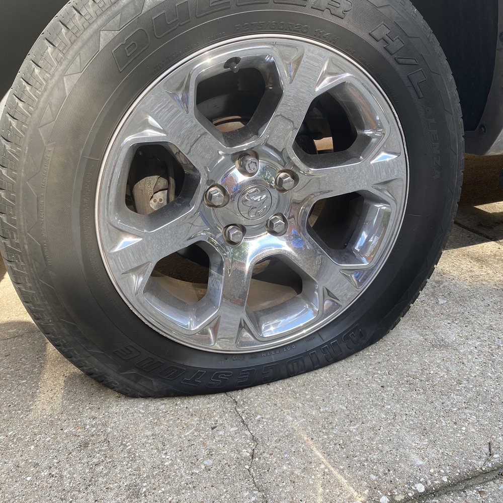 Just Tires - Flat tire in driveway - Tires Near Me - Frisco, Texas Just Tires - Flat tire in driveway - Tires Near Me - Frisco, Texas