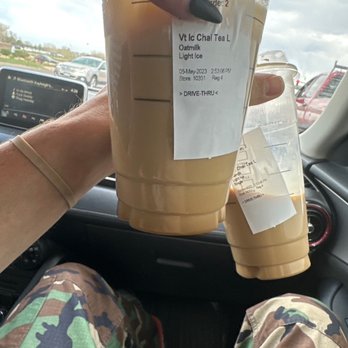 Starbucks - a person holding a cup of iced coffee - Coffee & Tea Near Me - Denver, Colorado