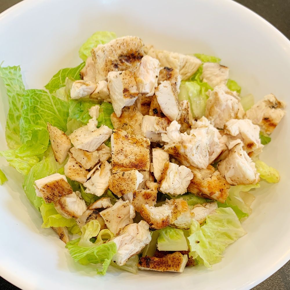 Build your own bowl: plain romaine lettuce with grilled chicken on top. They definitely didn't skimp on the chicken! Seasoned perfectly. Build your own bowl: plain romaine lettuce with grilled chicken on top. They definitely didn't skimp on the chicken! Seasoned perfectly.