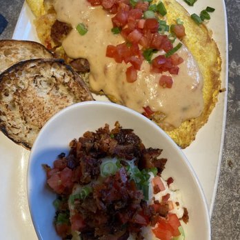 Another Broken Egg Cafe - Mardi Gras omelette, city grits and English muffin - Breakfast & Brunch Near Me - Nashville, Tennessee Another Broken Egg Cafe - Mardi Gras omelette, city grits and English muffin - Breakfast & Brunch Near Me - Nashville, Tennessee