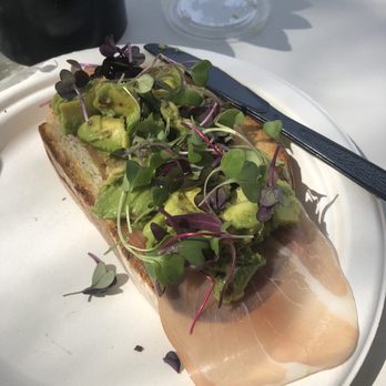 Communal - Avocado toast with micro greens and prosciutto - Coffee & Tea Near Me - San Diego, California Communal - Avocado toast with micro greens and prosciutto - Coffee & Tea Near Me - San Diego, California