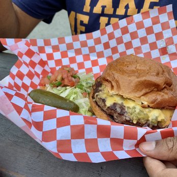 JL’s Burgers - a person holding a basket of food - Burgers Near Me - Charleston, South Carolina