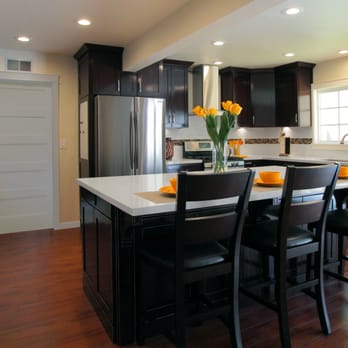 BMV Construction - Chocolate finish wood custom cabinets,color quarz counter tops, porcelain backsplash w/glass ribbon, LED lights, wood like tile - General Contractors Near Me - Whittier, California BMV Construction - Chocolate finish wood custom cabinets,color quarz counter tops, porcelain backsplash w/glass ribbon, LED lights, wood like tile - General Contractors Near Me - Whittier, California