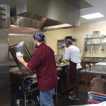 Burgundy's Local - two men in a commercial kitchen - Meat Shops Near Me - Fort Worth, Texas Burgundy's Local - two men in a commercial kitchen - Meat Shops Near Me - Fort Worth, Texas