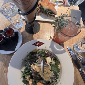 Ajax Tavern - Wagyu Steak Sandwich. Kale & Quinoa Caesar w/ Salmon - New American Near Me - Aspen, Colorado