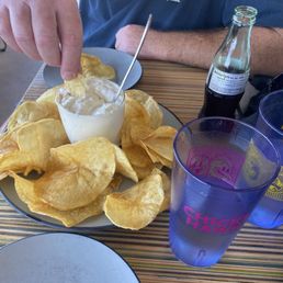 Potato chips and onion dip, hilariously tiny soda. Potato chips and onion dip, hilariously tiny soda.
