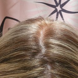 Dellaria Salons - Orange leak spots at roots.