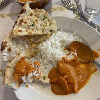 Apna Indian Grill & Bar - Butter chicken with rice, garlic naan, and paneer kulcha naan - Indian Near Me - Chicago, Illinois