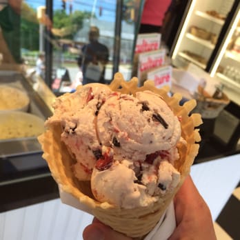 Arethusa Farm Dairy - A scoop of sour cherry (with bits of cherry and pieces of chocolate) in a homemade waffle cone. - Ice Cream & Frozen Yogurt Near Me - Bantam, Connecticut Arethusa Farm Dairy - A scoop of sour cherry (with bits of cherry and pieces of chocolate) in a homemade waffle cone. - Ice Cream & Frozen Yogurt Near Me - Bantam, Connecticut