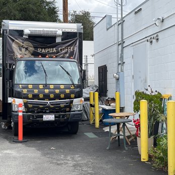 Papua Coffee - a truck parked in a parking lot - Coffee & Tea Near Me - Glendale, California Papua Coffee - a truck parked in a parking lot - Coffee & Tea Near Me - Glendale, California