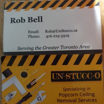 UN-STUCC-O - ows two business cards on a table - Stucco Services Near Me UN-STUCC-O - ows two business cards on a table - Stucco Services Near Me