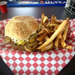 Chelsey’s On The Mesa - Chelsey's green chili  cheese burger with fries.