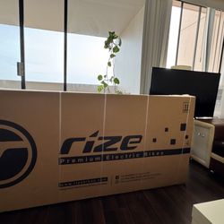 Rize Bikes - Compare it to a 50" TV -- should a customer carry this alone, or should proper help be provided?