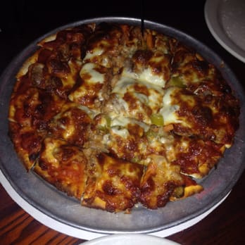 Exchequer Restaurant & Pub - Sausage and giardinera pizza. Cooked perfectly but they put so much topping on the pizza that it's hard to eat when cut so small. - Pizza Near Me - Chicago, Illinois