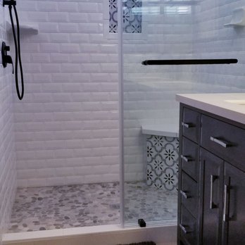 Rocca Tile & Granite - a bathroom with a walk in shower - Flooring Near Me Rocca Tile & Granite - a bathroom with a walk in shower - Flooring Near Me