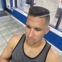 Eduardo's Barbershop - Skin fade with a hard part
