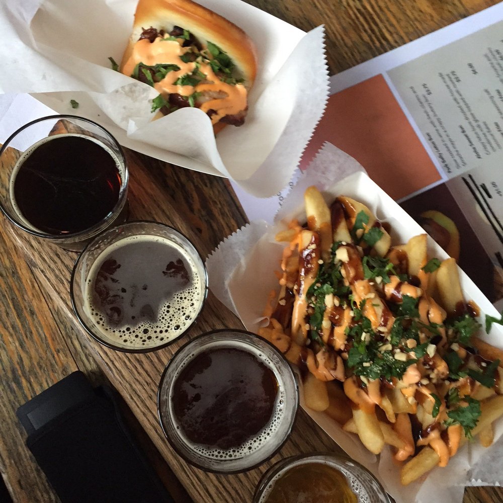 Seventh Son Brewing - Food trucks are usually parked outside for lunch; here's Aloha Streatery's shredded pork bun and loaded fries from last Saturday - Breweries Near Me - Columbus, Ohio