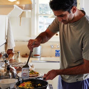 Mar Vista Farm + Cottages - A guest making breakfast in the fully equipped kitchen at Mar Vista. - Bed & Breakfast Near Me - Gualala, California Mar Vista Farm + Cottages - A guest making breakfast in the fully equipped kitchen at Mar Vista. - Bed & Breakfast Near Me - Gualala, California