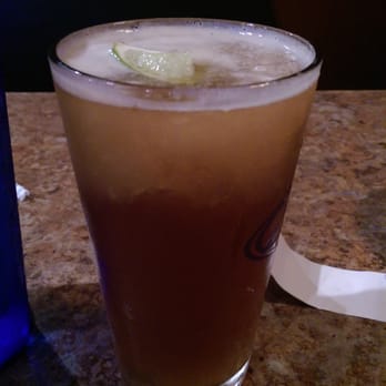 Rio Bravo - Rio Iceberg - a Dos XX Amber topped with homemade frozen margarita and a lime. Excellent drink! - Mexican Near Me - Greensboro, North Carolina
