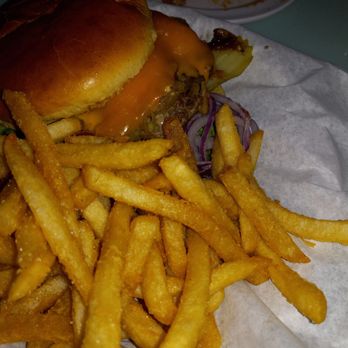 The 377 Brewery - Hot booty burger was yummy - A cheeseburger with a bun, melted cheese, and toppings, served with a side of French fries on parchment paper. - Brewpubs Near Me - Albuquerque, New Mexico